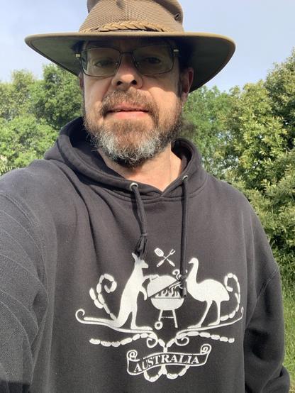 Selfie of myself wearing an official Democracy Sausage fundraising hoodie and my trusty Baramah hat.