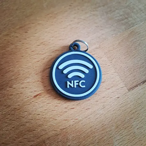 Verso de la médaille avec un logo NFC pour montrer qu'il y a un tag NFC à l'intérieur.