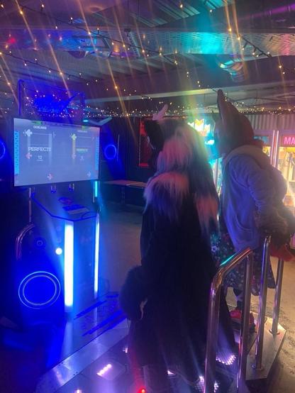 Noir (Nirik (Kirin) fursuit with white, pink and blue mane) and Lillith (devil fox fursuit) play StepmainiaX.
