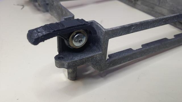 The prototype installed on the internal frame, folded in. A screw over a washer holds it in place.