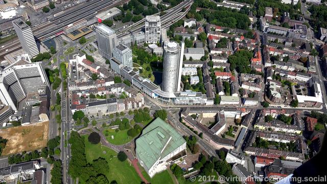 An aerial photo of the innogy headquaters (former RWE tower) and the Aalto theater of Essen.