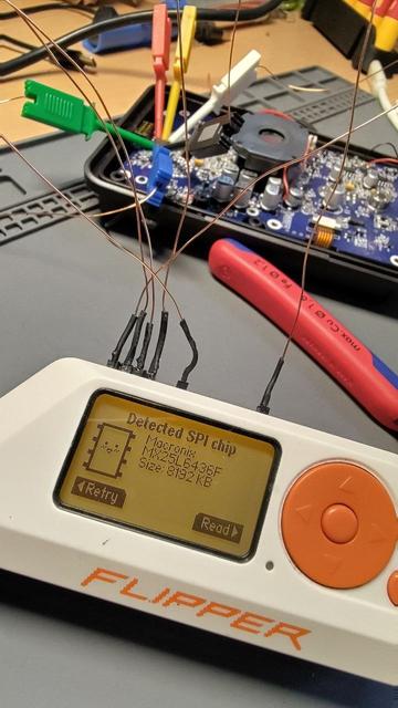 Flipper Zero which shows:
Detected SPI chip
MX25L6436F
Size: 8192 KB

In the background is some hardware which the Flipper  Zero is conncted