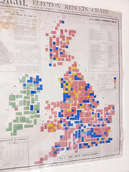 A cartogram of the composition of the parliament of the United Kingdom of Great Britain and Ireland after the 1906 General Election ("the administration of Mr Cambell-Bannermann").

Each constituency is shown as a square of constant size roughly located in a geographically accurate position so that the end result is a recognisable map of Britain and Ireland.. Squares are coloured according to political party (e.g., blue for Conservative, red, apparently, for the Liberals, yellow for Labour).

Great Britain is predominantly a mix of red and yellow, blue still dominates inis what is now Northern Ireland. Most of Ireland returned Irish Nationalists, shown with a greenish colour.