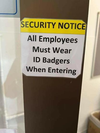 An sign in an office "SECURITY NOTICE. All Employees Must Wear ID Badgers When Entering"