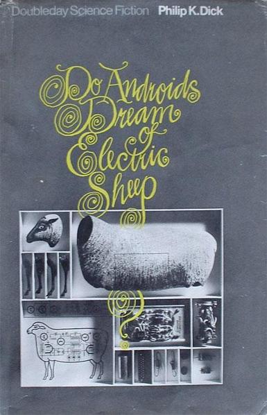 The original cover of DADOES features an elaborate typeface in yellow on a grey background, there is a collage of sheep parts, the bottom left one features the Electric Sheep.