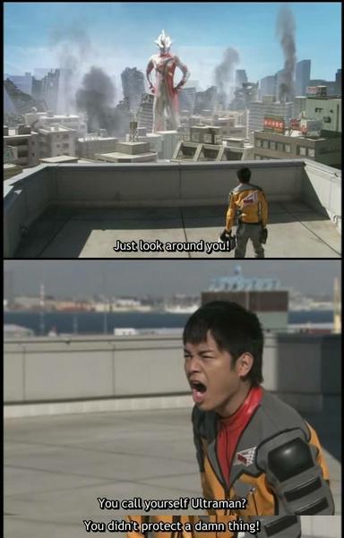 Ultraman Mebius standing over a wrecked cityscape, while Ryu from Team GUYS yells at him.
"Just look around you!  You call yourself Ultraman? You didn't protect a damn thing!"