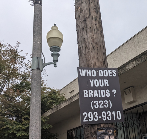 Sign: Who does your braids?