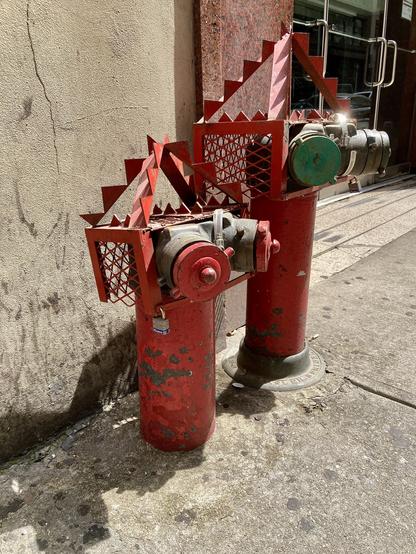 Sharp pointy metal frame installed on top of hydrant to stop people from sitting on them, New York.