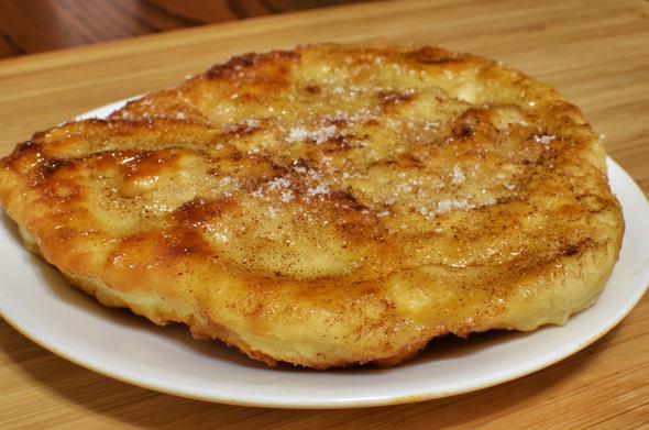 Bannock (also known as fry bread) with honey and cinnamon, 29 October 2013.
Photo by jeffreyw on Flickr, licensed under Creative Commons: CC BY 2.0