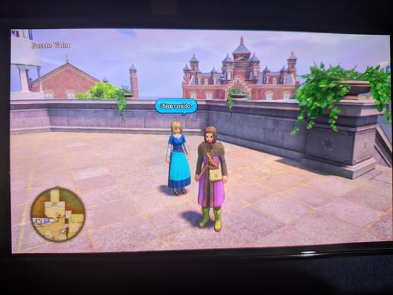 Me in a city near the coast. A girl is welcoming me in the entrance