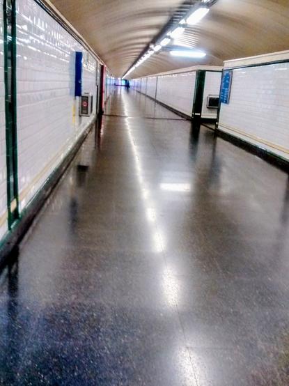 An empty corridor of an underground station.