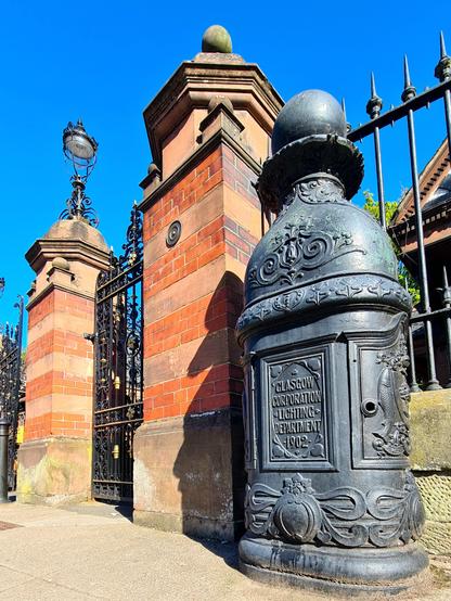 An ornamental lamp base at the entrance to Glasgow's Botanic Gardens.