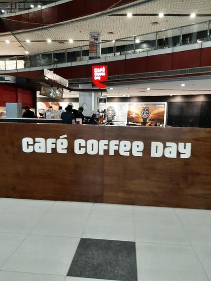 A Cafe Coffee Day kiosk in a mall.
