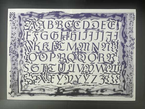 A spread with all initials, surrounded by decorative rasterized frame.