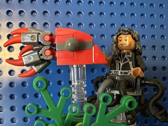 Lego MerKraken Ed petting a red Lego squid