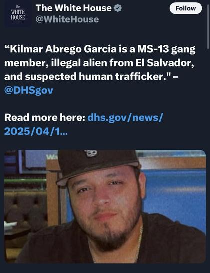 An image featuring a man with a beard and wearing a baseball cap, seated in a casual setting. The background includes a blue booth and a wooden partition. The accompanying text from The White House describes the individual as a suspected gang member and human trafficker…
