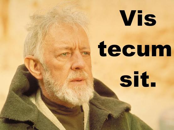 Close up on the head of old Obi-Wan Kenobi from Star Wars Episode IV. The text says: "Vis tecum sit."