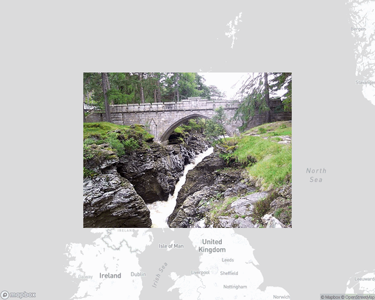 A photo of or from a national park from the linked website, overlaid on a cropped world map where it's located.