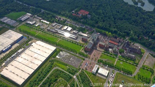 An aerial photo of the coal mine Ewald with trees around.