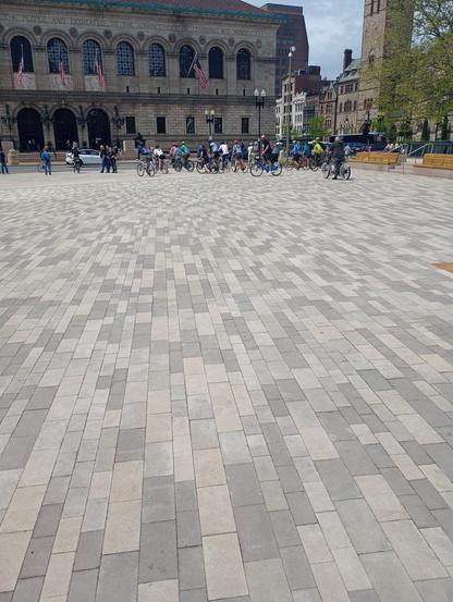 Brick paving, bikes and a building in the background