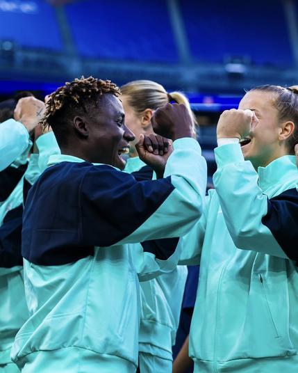 Lacho smiling as she goes through the Starting XI line