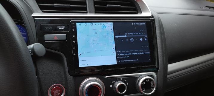 Still image. Car radio showing a map of not my location side by side with gonemad media player playing Dimitri from Paris' version of Stetsasonic - Talkin' All That Jazz