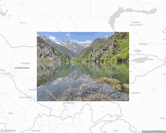 A photo of or from a national park from the linked website, overlaid on a cropped world map where it's located.