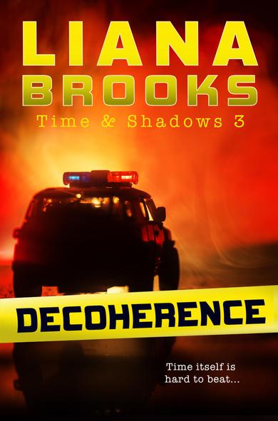 The cover for Decoherence– Yellow police tape with the title is crossed in front of a scene with the silhouette of a truck with police lights on the top. The authors name, Liana Brooks, is at the top of the cover and the tag line, “Time itself is hard to beat…” is in the bottom right corner.