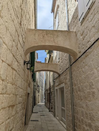 Old town narrow pedestrian path in a village on the Dalmatian coast