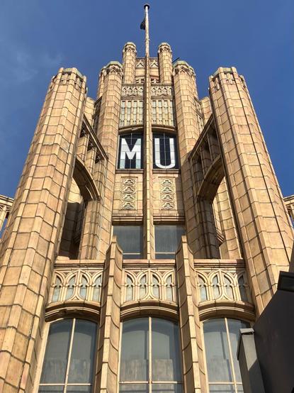 An art deco style brown building spire