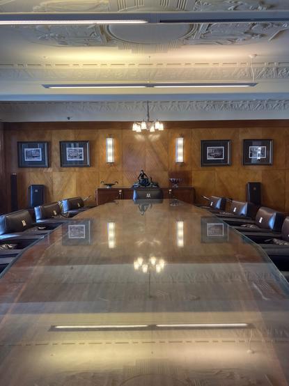 An art deco style board room with a large heritage listed table