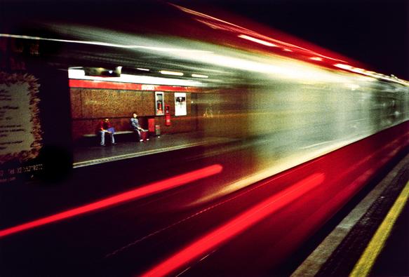 A long exposure shot of a tube train arriving at the Porta Venezia underground station, with long trails of lights and people waiting on the other side of the platform. Taken on 35mm Kodak Ektachrome 64T film using a Lomography Lc-a camera.