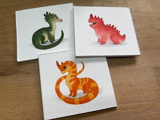 Three tiny dragon paintings, one green, one red and one orange with lovely markings!