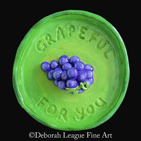 Add a pop of playful charm to your space with this vibrant "Grapeful For You" art print! Featuring a juicy cluster of purple grapes against a bright green plate with the punny message embossed around the rim, this cheerful design is perfect for kitchens, dining areas, or as a heartfelt thank-you gift. Ideal for pun lovers, fruit art collectors, and anyone who appreciates a good dose of humor with their home decor.

Whether you're expressing gratitude or simply brightening up a room, this whimsical fruit pun art print delivers a sweet, smile-worthy message.

A cluster of purple grapes sits in the center of a bright green plate, with the phrase "Grapeful for you" inscribed around the rim. The vivid colors and playful pun create a cheerful and whimsical vibe.