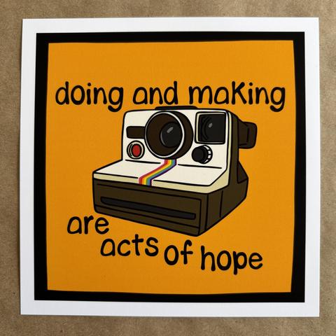 original art by AnneArchy depicting a vintage polaroid camera with hand lettering of the words "doing and making are acts of hope"