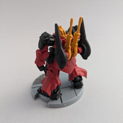 The back of a painted Gundam Artifact Rick Dias. It is painted in red, black, and yellow.