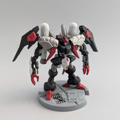 A Gundam Artifact Byarlant Custom painted in red, black, gunmetal, and white. It is on a starship style base.