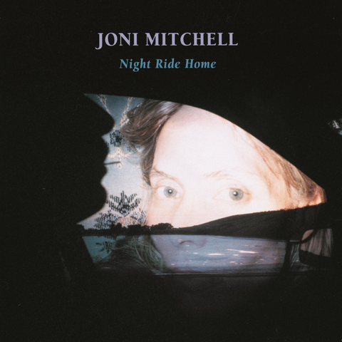 The cover photo of Joni Mitchell's 1990s album Night Ride Home, superimposing a side view silhouetted face of a car passenger with Mitchell's eyes as if in a rear view mirror.