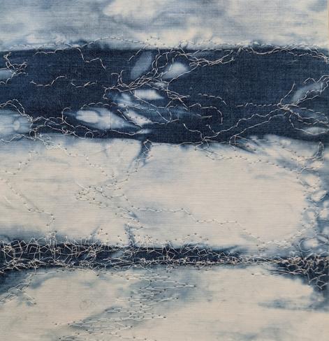 blue and white fabric with free machine stitch in fine white thread, semi-abstract inspired by my view of the sea here in Dumfries and Galloway.