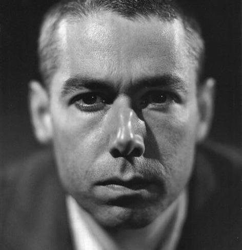 Black & white photo of Adam Yauch looking at the camera