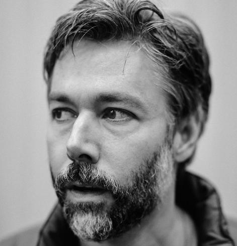 Bearded black & white Yauch looking off to the side