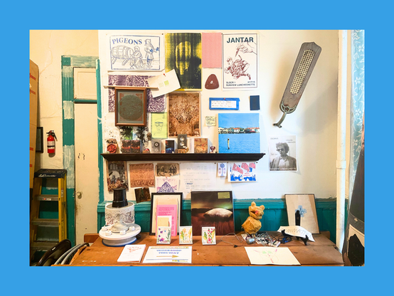 Inside Sunview Luncheonette,  a guerilla art space and community center in Brooklyn, with various items from the music community on display. Photo by Chad Laird.