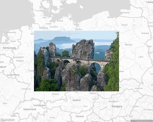 A photo of or from a national park from the linked website, overlaid on a cropped world map where it's located.