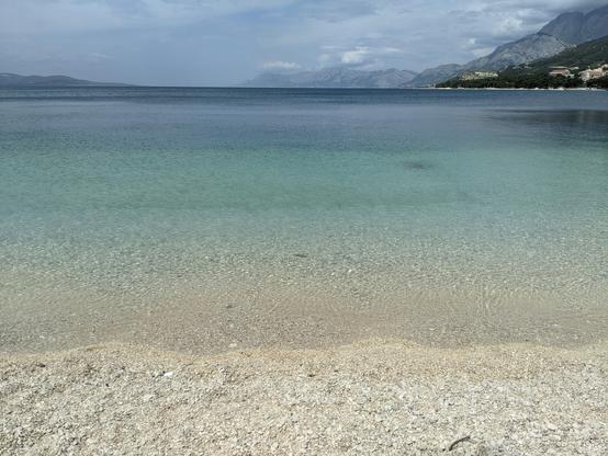 Turquoise pebble beach bay on the Dalmatian coast