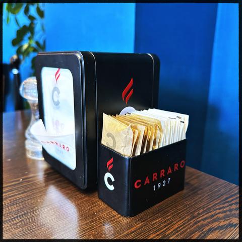 Napkin dispenser and sugar box