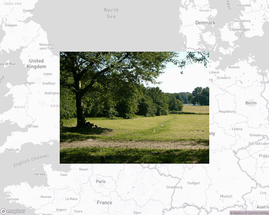A photo of or from a park from the linked website, overlaid on a cropped world map where it's located.