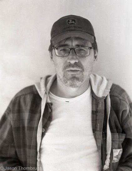 Self portrait of a photographic artist who is always cold and dresses like a farmer when he works.
