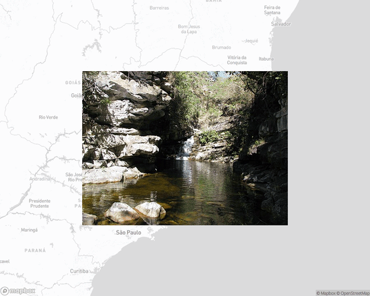 A photo of or from a national park from the linked website, overlaid on a cropped world map where it's located.