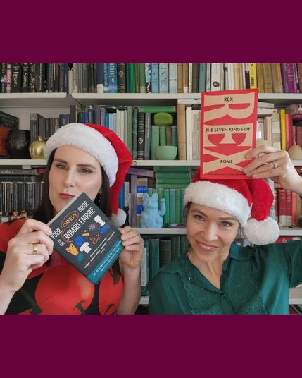Image three: Dr Rad holds ‘Your Cheeky Guide to the Roman Empire’ and Dr G holds ‘Rex: The Seven Kings of Rome’. Both are smiling but it’s all a bit silly.