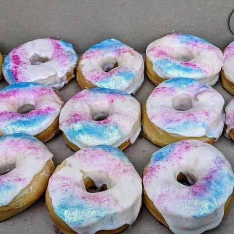 Nine ring donuts, in trans flag colours